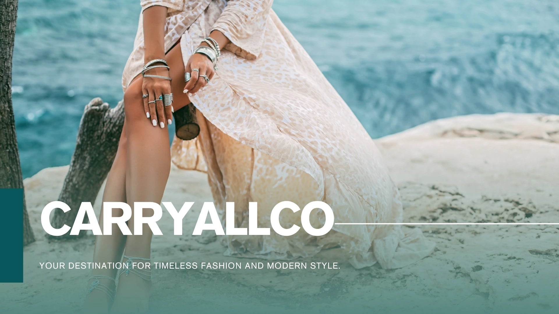 Woman in a white dress sitting on a rock by the water with 'CARRYALLCO' branding.