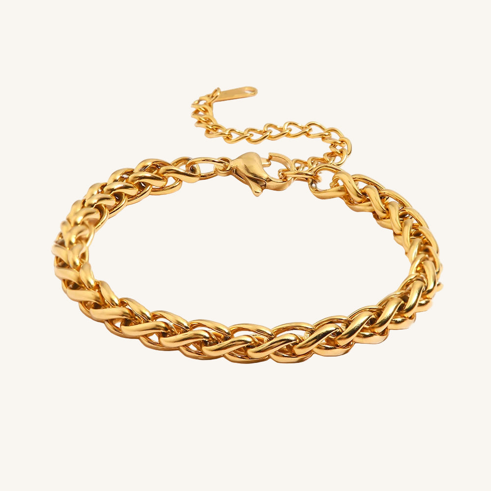 Gold chain bracelet on a white background