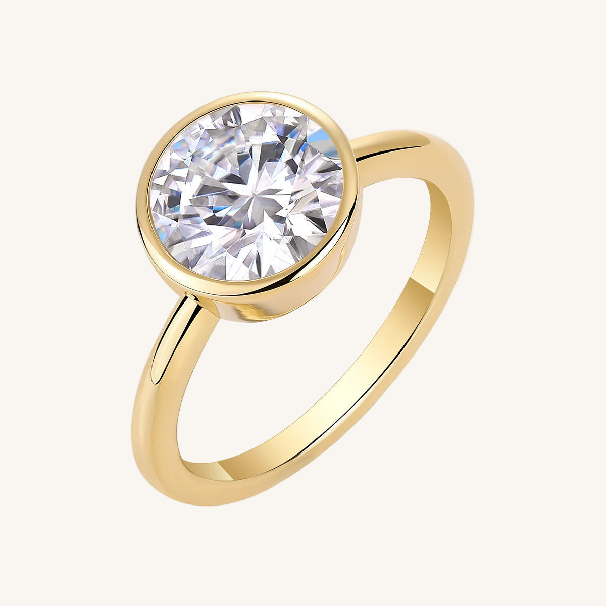 Gold ring with a large diamond on a white background