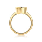 Gold ring with a small gemstone on a white background