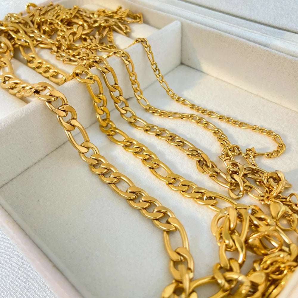 Gold chains displayed in an open jewelry box