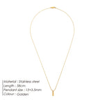 Gold necklace with pendant on a white background
