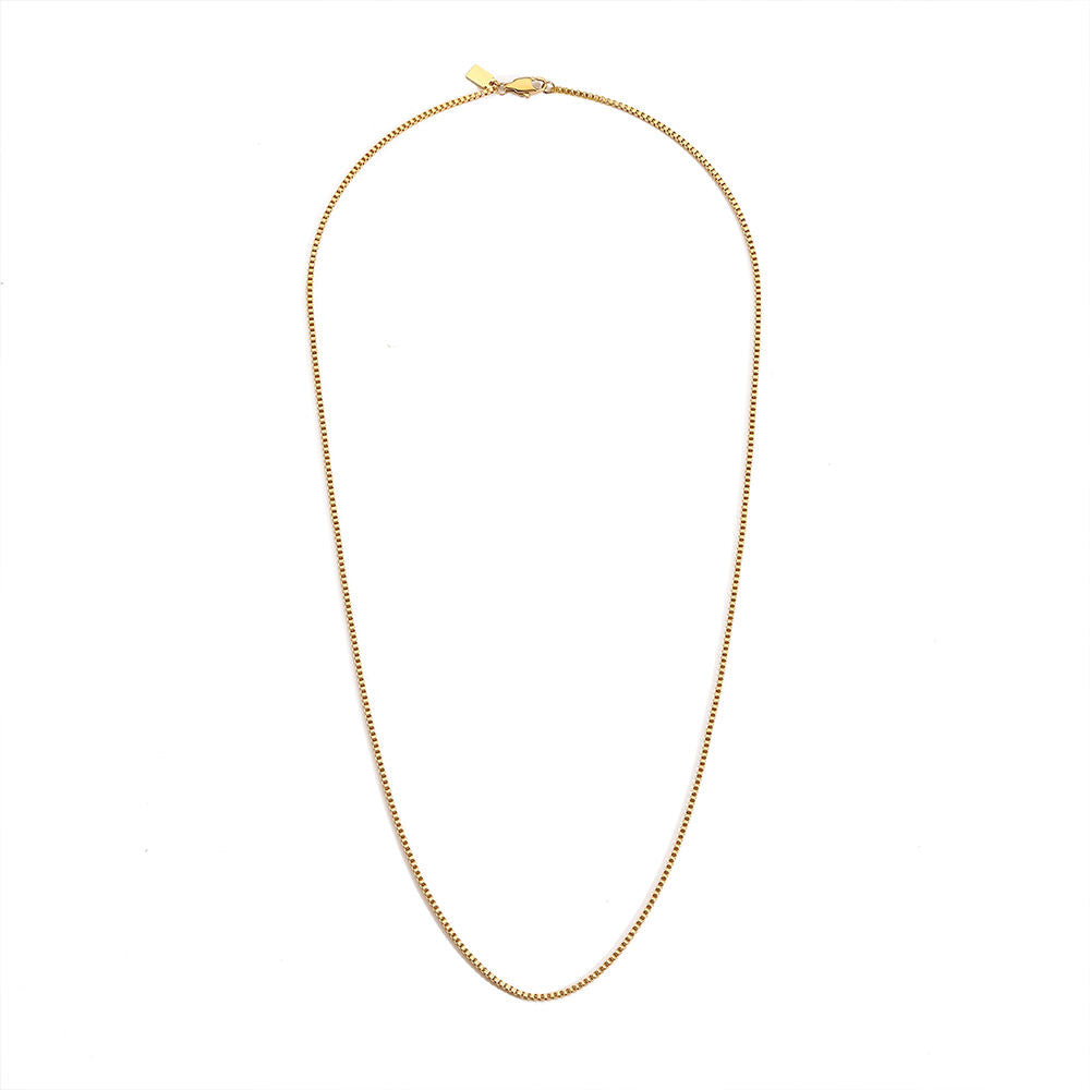 Gold necklace on a white background