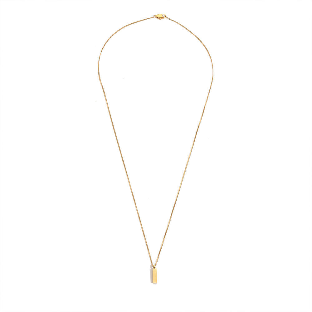 Gold necklace with a small pendant on a white background