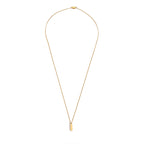 Gold necklace with a small pendant on a white background