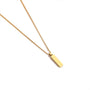 Gold necklace with a rectangular pendant on a white background