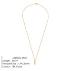 Gold necklace with pendant on a white background