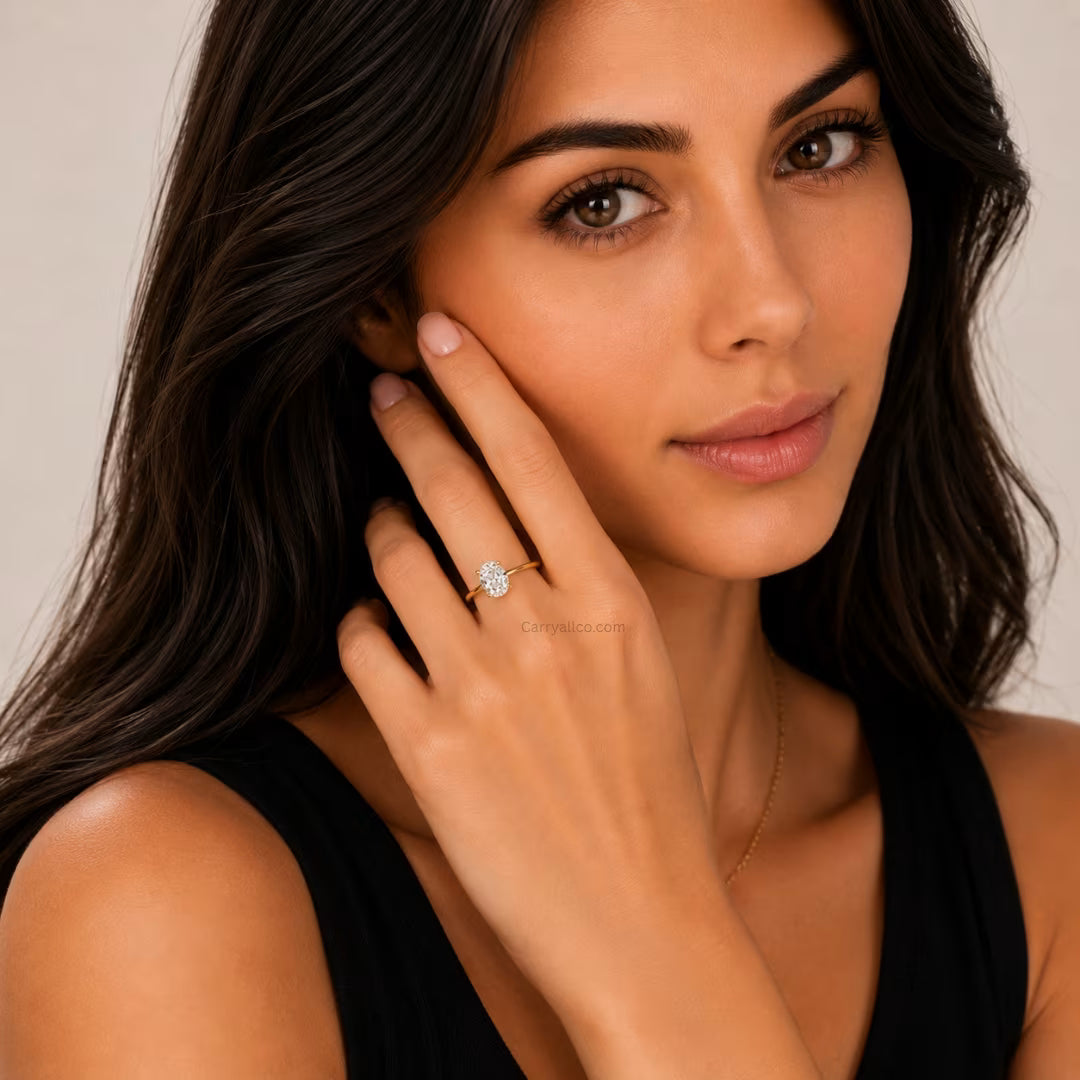 Woman wearing a diamond ring on a neutral background