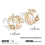 Gold and pink floral earrings with measurements and material details on a white background