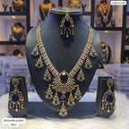 Jewelry set with necklace and earrings on a mannequin bust, with a blurred jewelry store background.