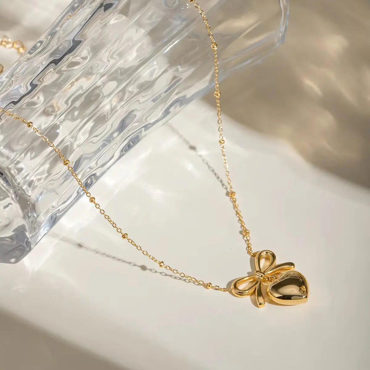 Carryallco 18K Gold Plated Demi-fine Bow Heart Necklace
