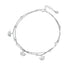 Silver anklet with fan-shaped charms on a white background