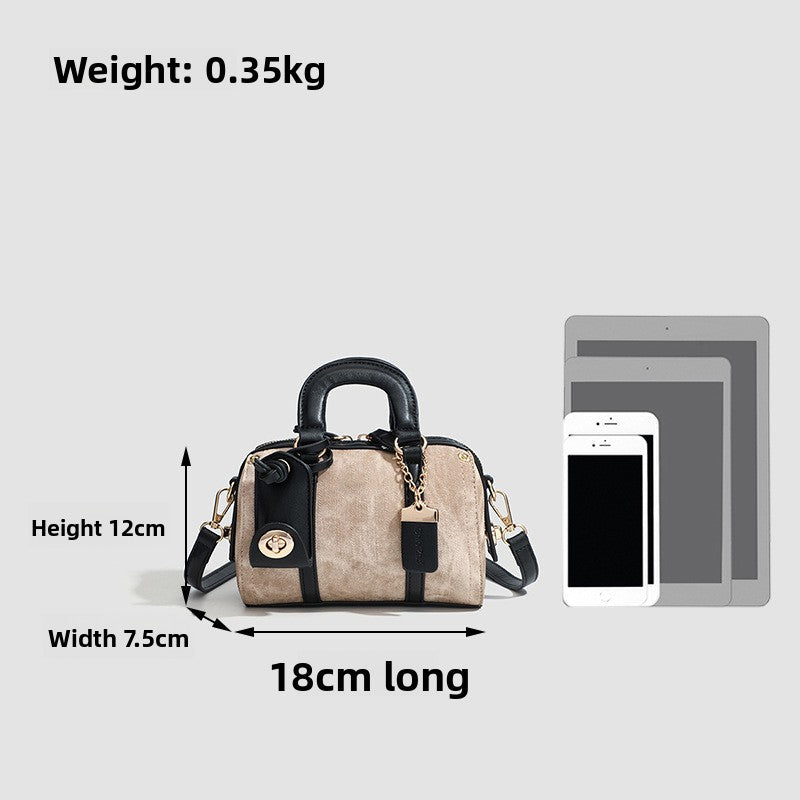 Handbag with dimensions and weight information on a white background
