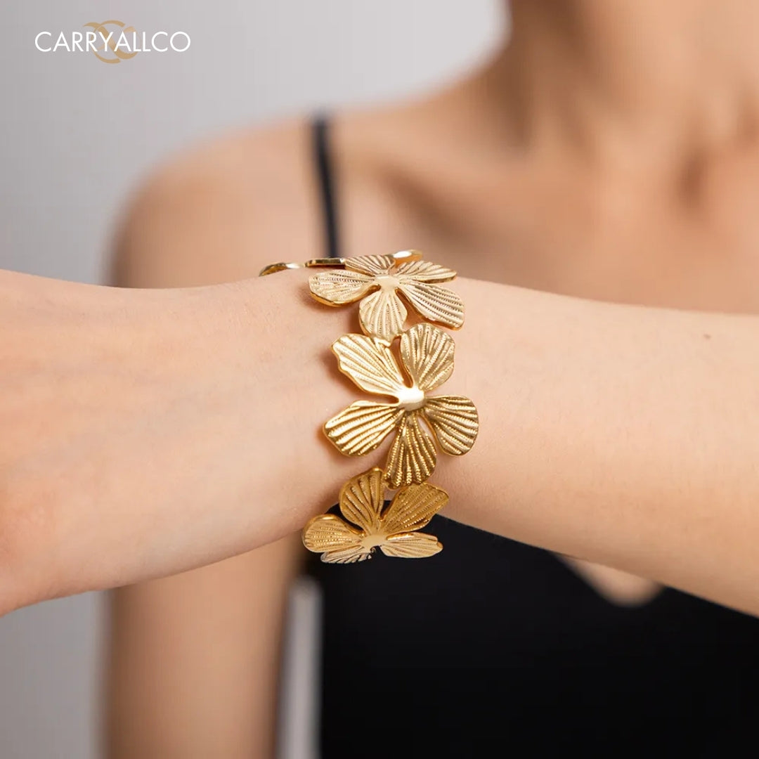 Floral Elegance Open Cuff Bracelet – worn on the wrist with a black top