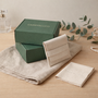 CARRYALLCO jewelry packaging on a wooden surface with a neutral background