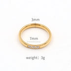 Gold ring with measurements on a white background