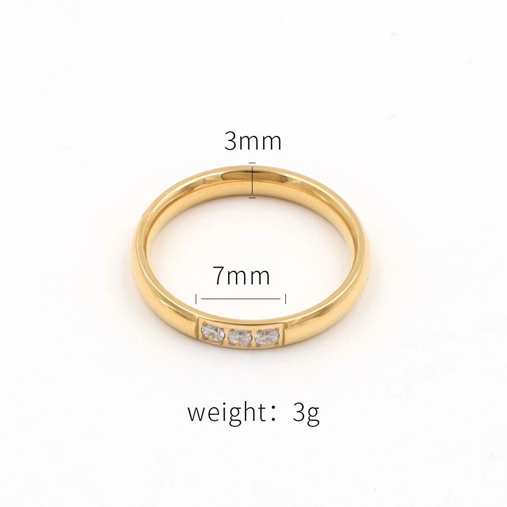 Gold ring with measurements on a white background