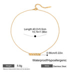 Gold necklace with measurements and material details on a white background