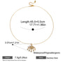 Gold necklace with pendant, measurements, and product details on a white background