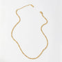 Gold chain necklace on a white background