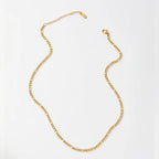 Gold chain necklace on a white background