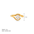 Gold ring with a clear stone on a white background, showing measurements and product details.