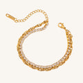 Gold bracelet with clear stones on a white background