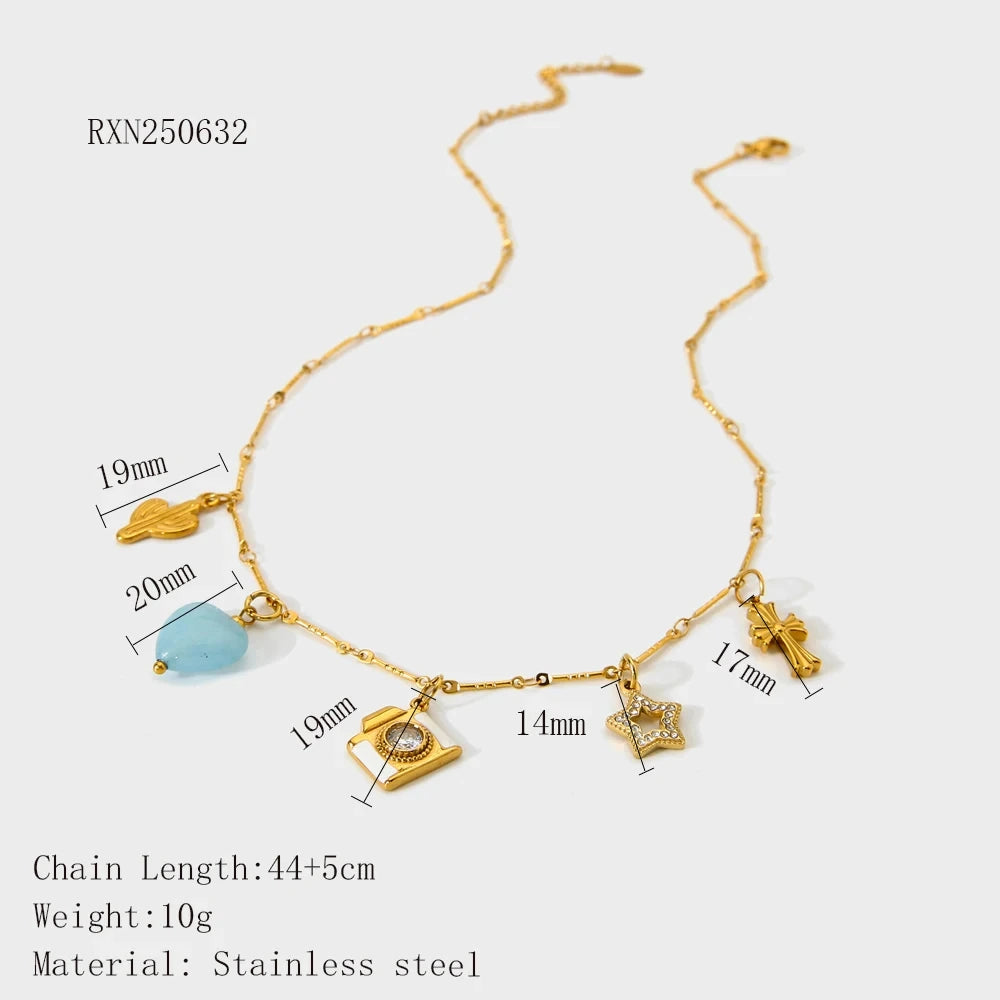 Gold necklace with charms and measurements on a white background