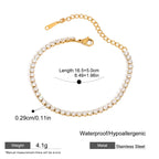 Gold bracelet with pearl-like beads on a white background