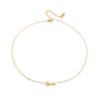 Gold necklace with 'love' pendant on a white background
