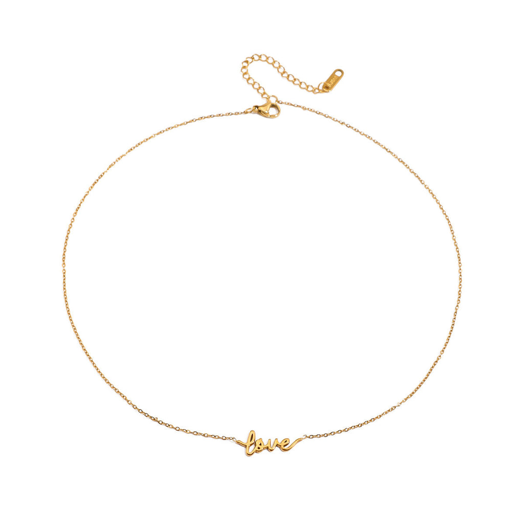 Gold necklace with 'love' pendant on a white background