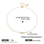 Gold necklace with 'love' pendant on a white background, showing measurements and material details.