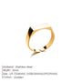 Gold ring with black accent on a white background