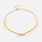 Gold necklace with a small clasp on a white background