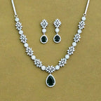 Jewelry set with necklace and earrings on a beige background