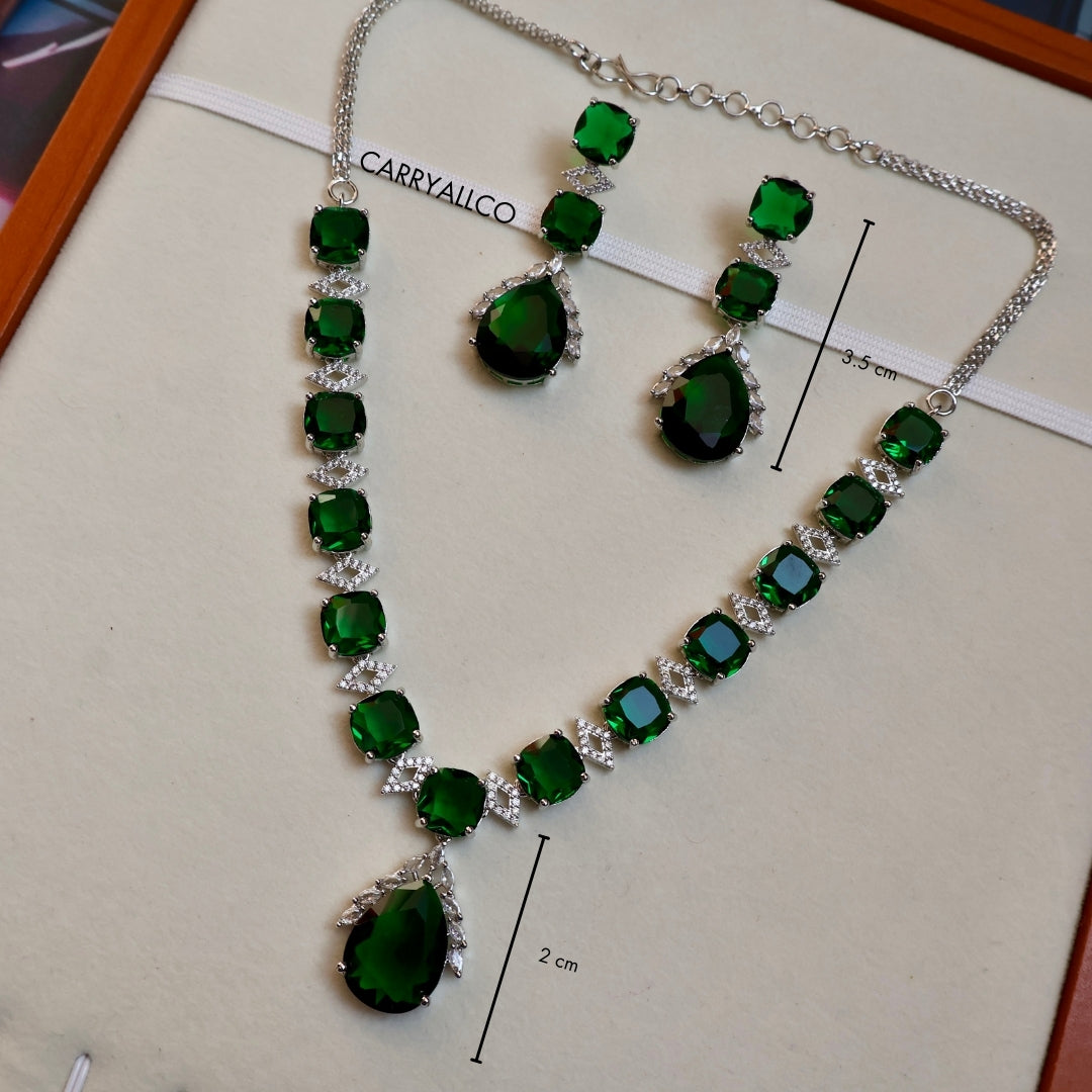 Green gemstone necklace and earrings on a white background with 'CARRYALICO' branding.