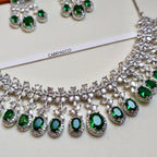 Jewelry set with green gemstones and silver accents on a white background, featuring the brand 'CARRYALLCO'.