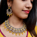 Carryallco Antique Gold-Plated Reverse AD Yellow Necklace Set with Mangtika Carryallco