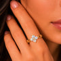 Gold ring with diamonds on a person's finger