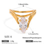 Gold ring with a clear gemstone, showing measurements and material details on a white background.