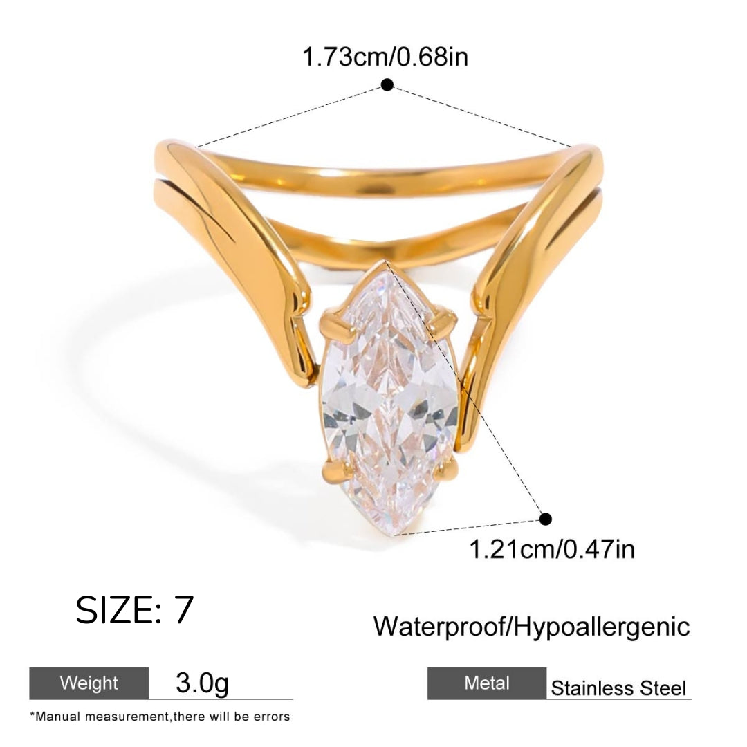 Gold ring with a clear gemstone, showing measurements and material details on a white background.