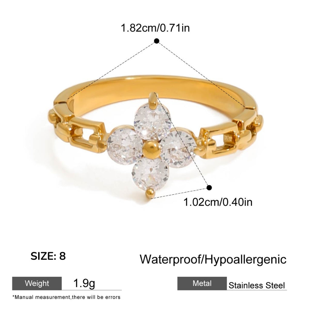 Gold ring with diamond-like stones and measurement details on a white background