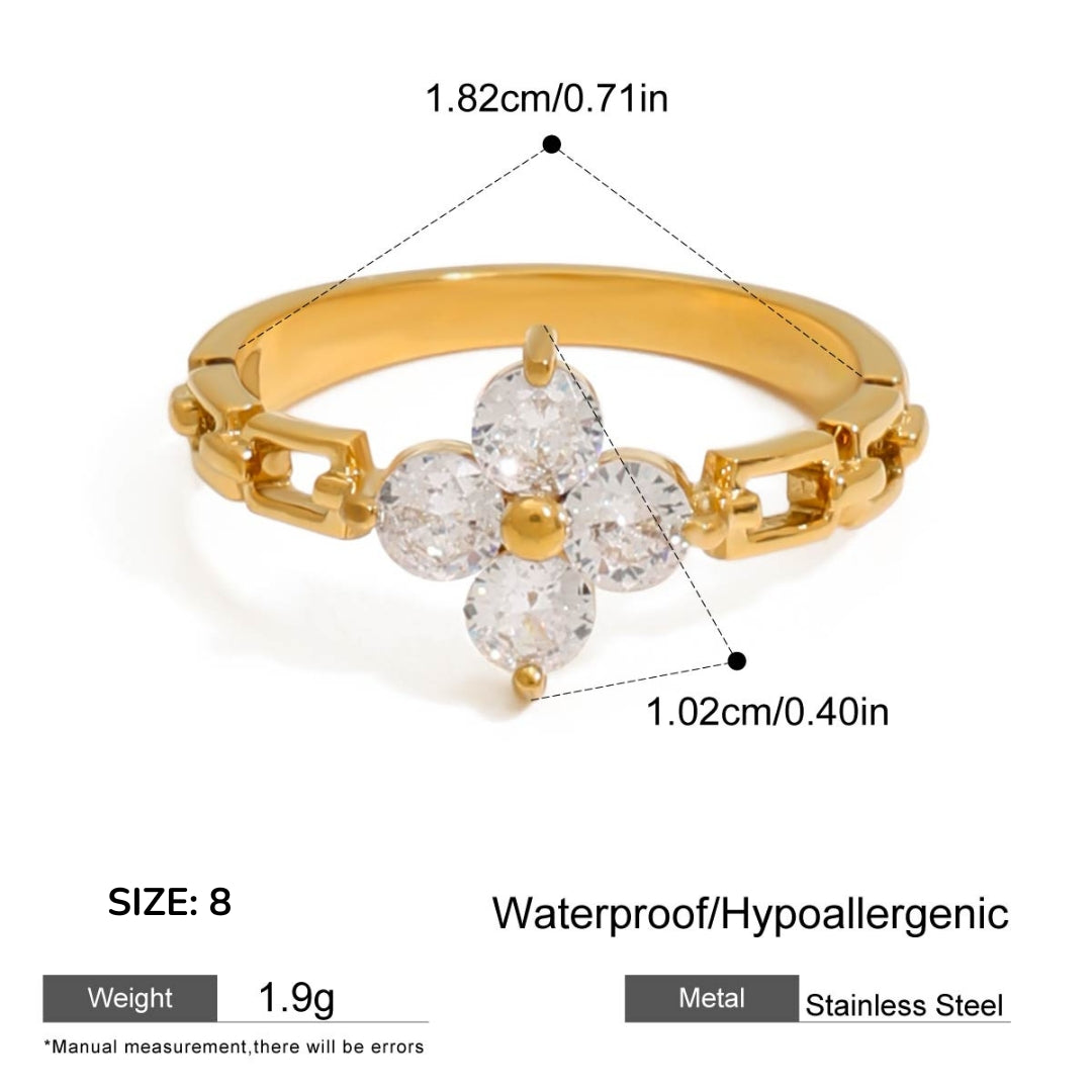 Gold ring with diamond-like stones and measurement details on a white background