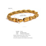Gold chain bracelet with measurement details on a white background