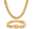 Gold chain necklace and bracelet on a white background