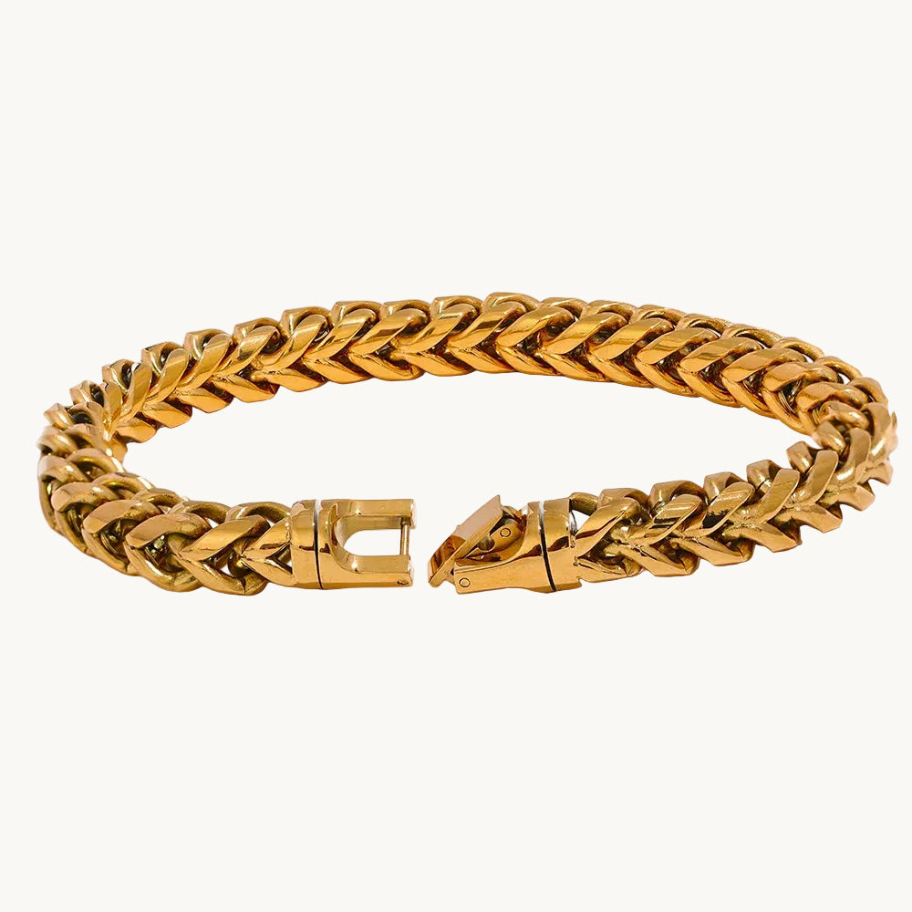 Gold chain bracelet on a white background