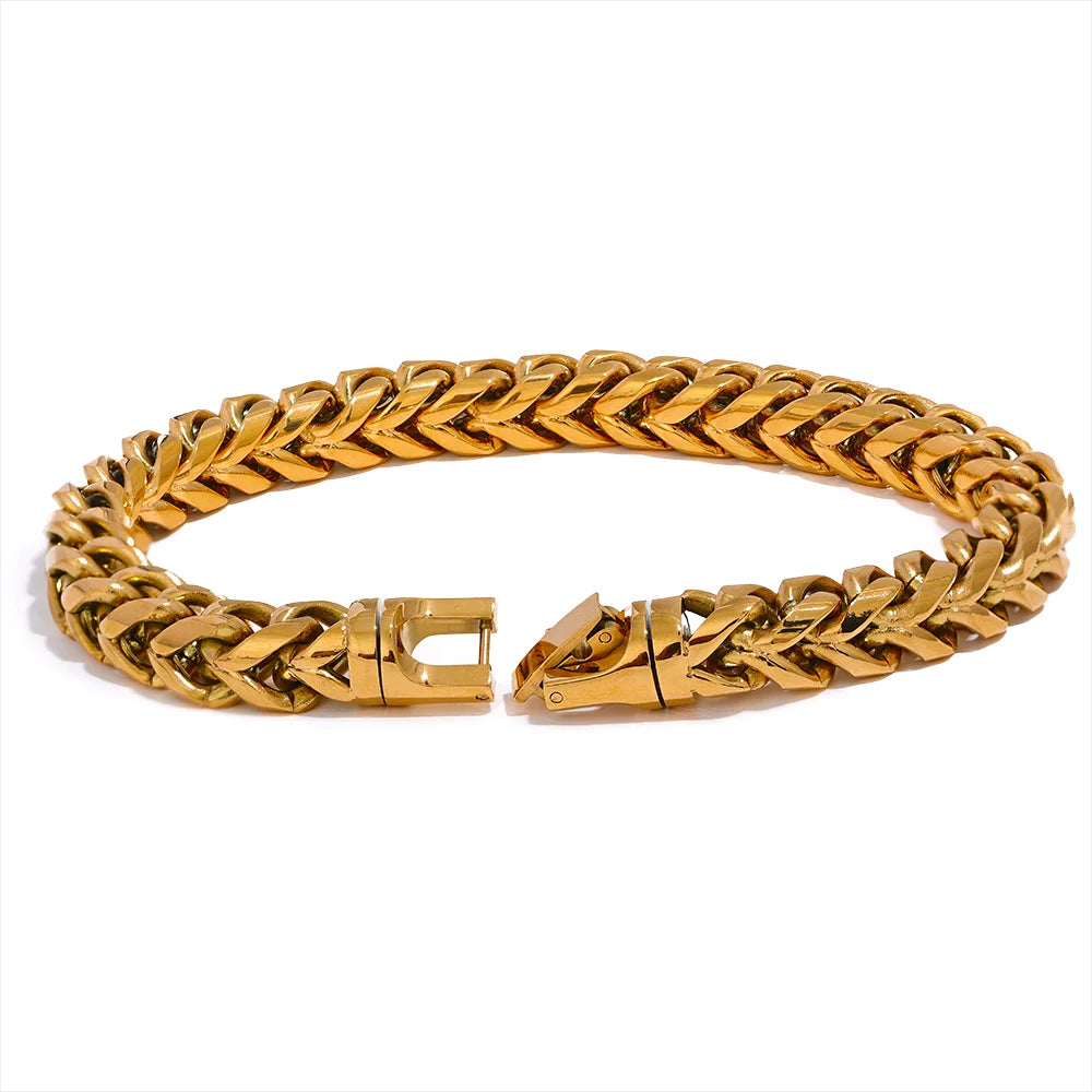 Gold chain bracelet on a white background