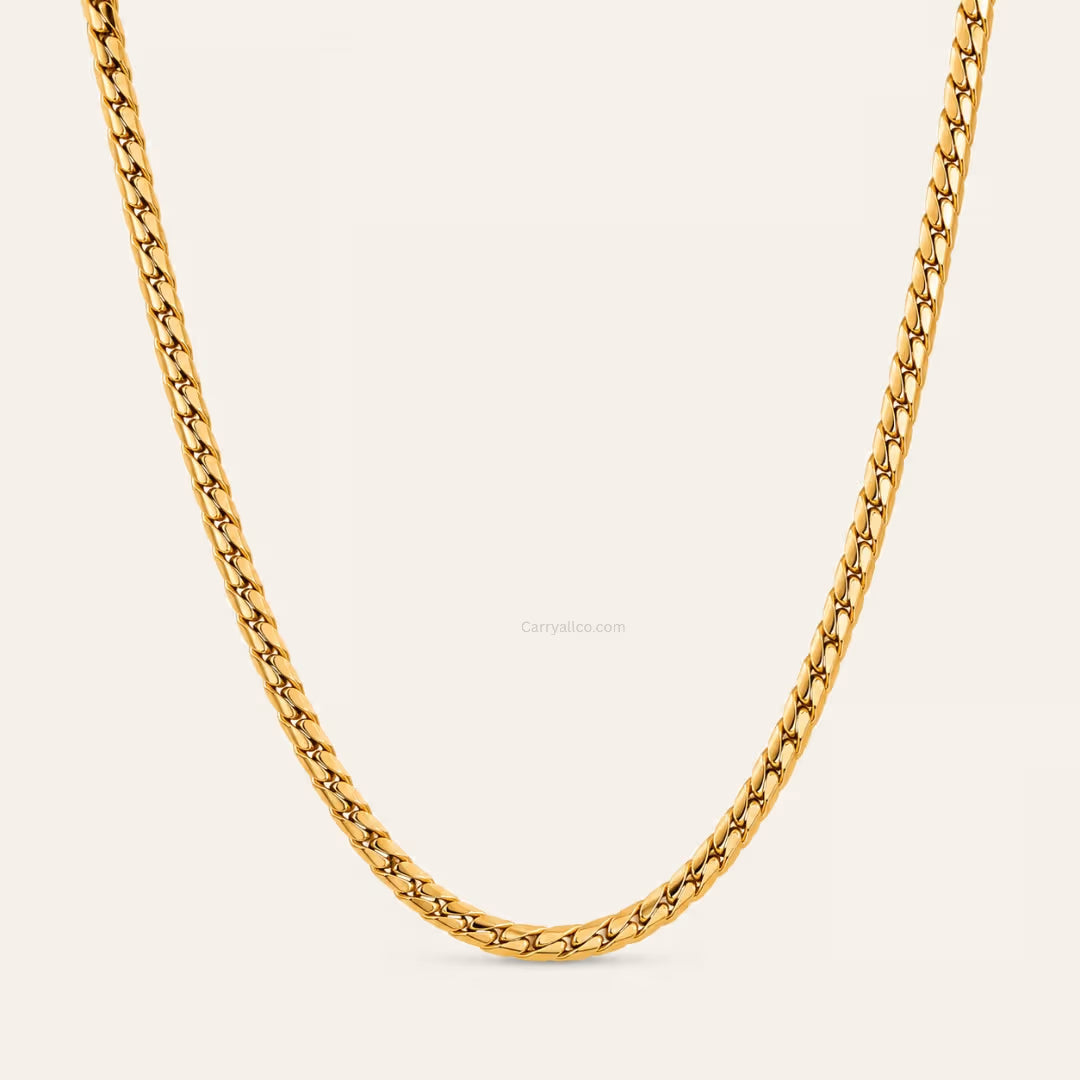 Gold chain on a light beige background