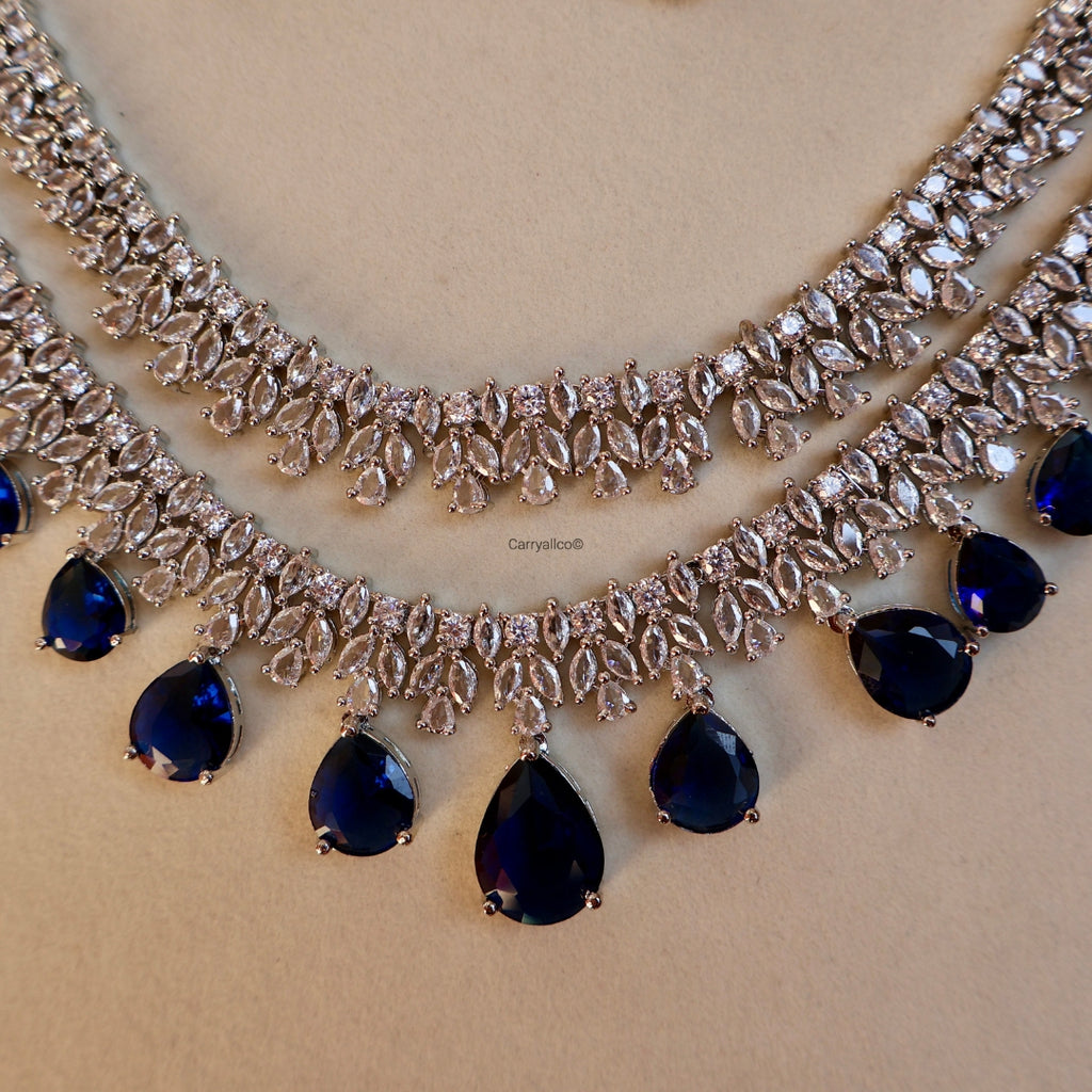 Necklace with blue gemstones on a beige background