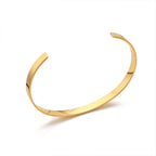 Gold bangle on a white background